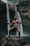 flexing man waterfall - barbell flex